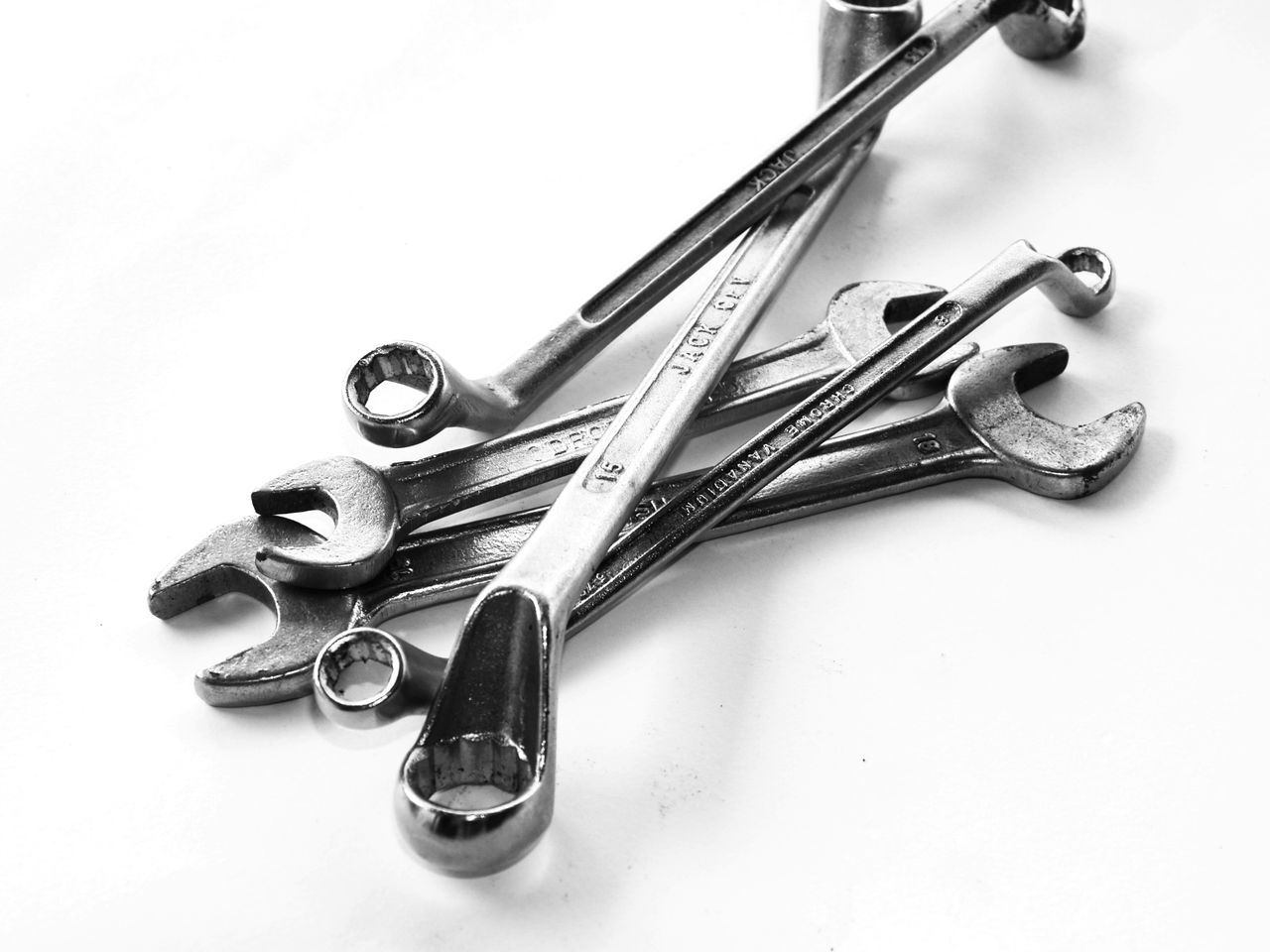 creative-03 A collection of steel wrenches displayed against a white backdrop, perfect for toolkits.
